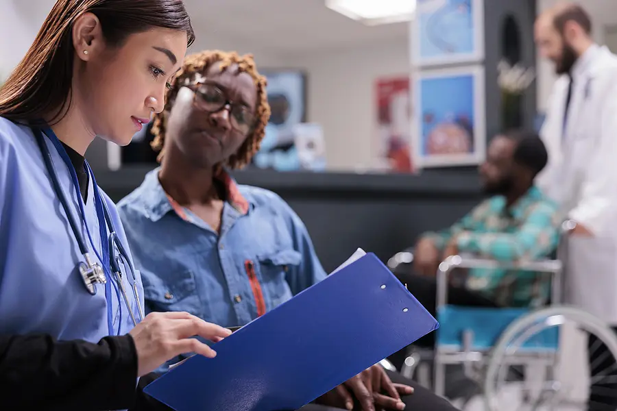 Nurses looking over the schedule.