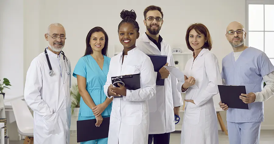 happy, diverse team of doctors and healthcare staff