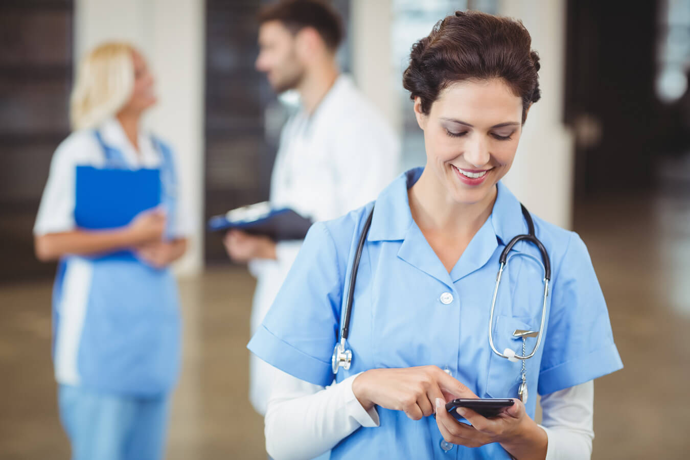 nurse checking her nursing schedule via Schedule360 the best nurse scheduling software on her phone